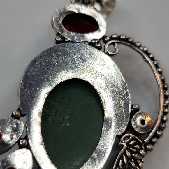 Sterling Silver Pendant with Green Carved Face and Red Garnet Accents - Picture 3 of 10